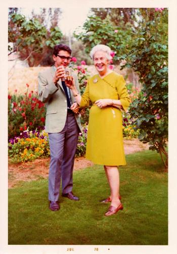 Mrs. Demos and Rick Newton (class of ‘70 and former Alumnus Trustee) clinking glasses in Mrs. Demos’ garden in Kifissia
